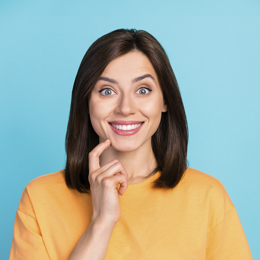 A Young Woman Smiling With A